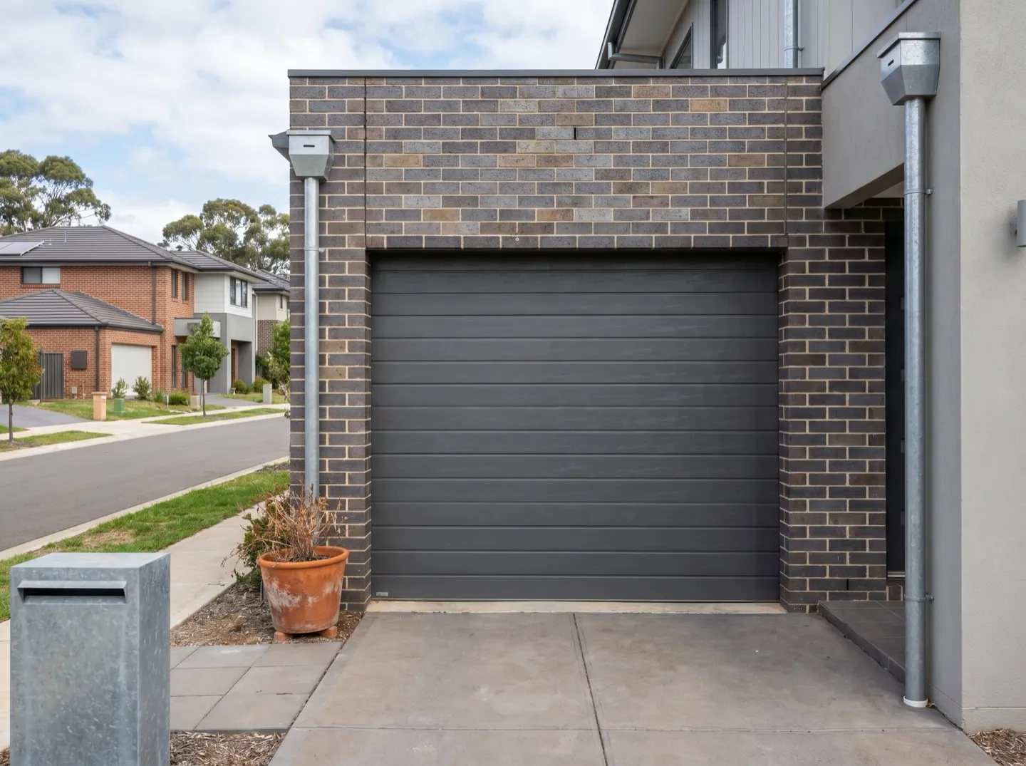A sectional panel-lift garage door